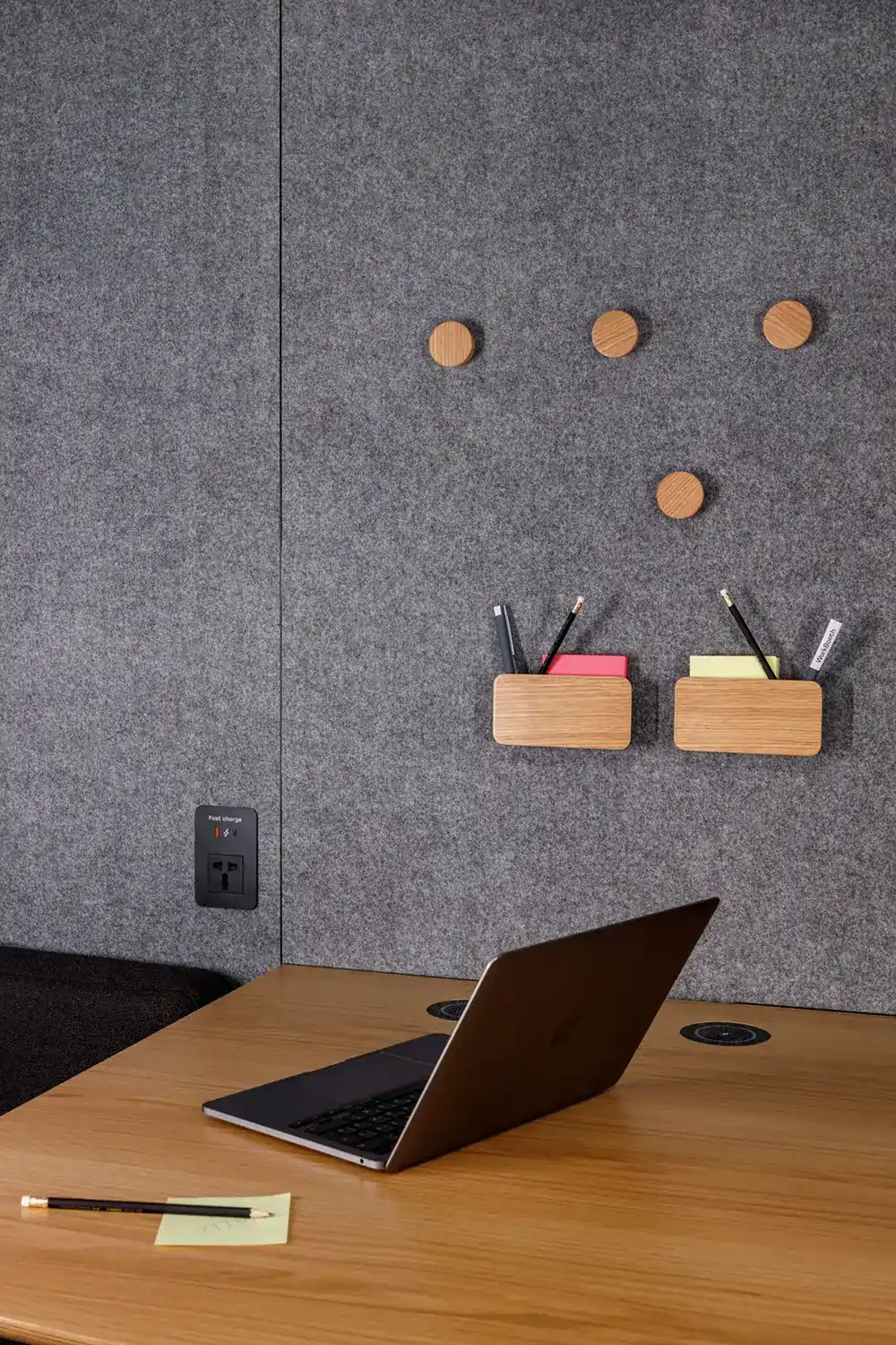 comfortable workspace with laptop in booth