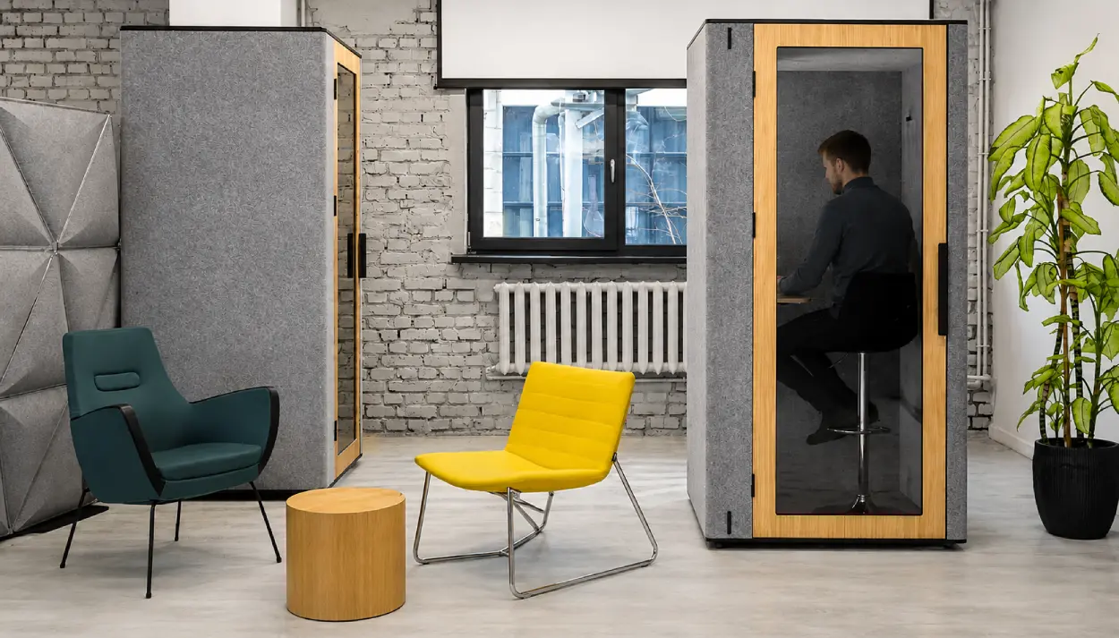 Man inside an office phone booth